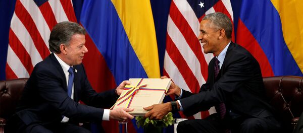 El presidente de Colombia, J. M. Santos, y el exmandatario de EEUU, Barack Obama - Sputnik Mundo