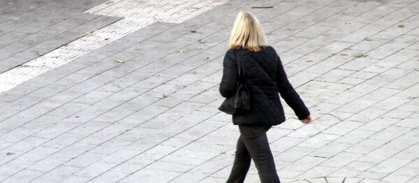 Una mujer - Sputnik Mundo