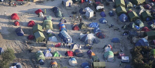 El campo de refugiados en Calais, Francia - Sputnik Mundo