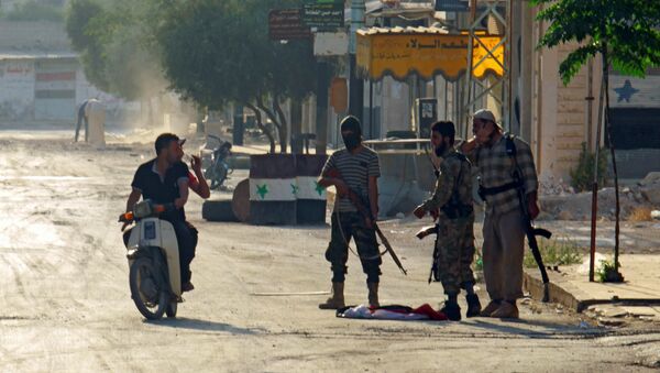 Terrorists from the Jund al-Aqsa group man a checkpoint in Taybat al Imam town after they advanced in the town in Hama province, Syria August 31, 2016 - Sputnik Mundo