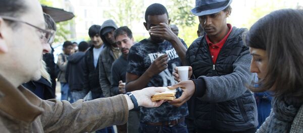 Los refugiados sirios en París - Sputnik Mundo