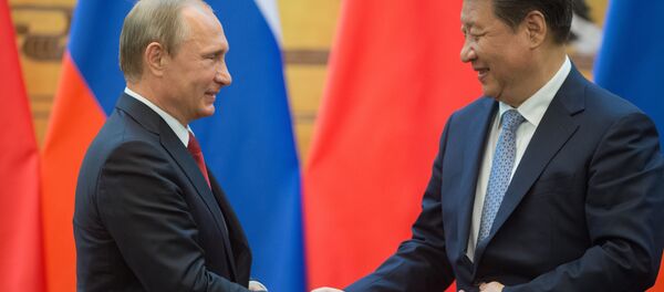 Vladímir Putin, presidente de Rusia, y Xi Jinping, presidente de China - Sputnik Mundo