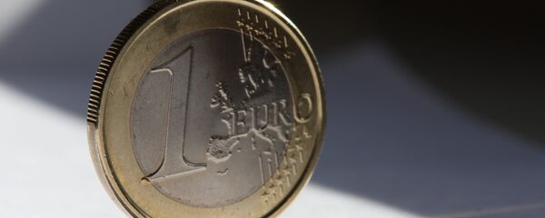 Una moneda de euro - Sputnik Mundo