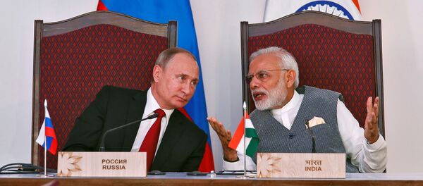 Vladimir Putin, el presidente de Rusia, y Narendra Modi, el primer ministro de la India - Sputnik Mundo