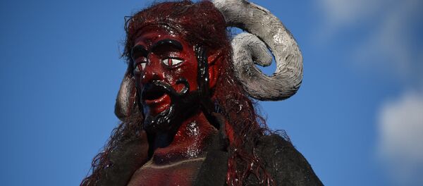 A devil's figure is seen before being set ablaze during celebrations in honor of the Virgin of the Immaculate Conception, on December 7, 2015 in Antigua Guatemala municipality, Sacatepequez departament, some 45 km southeast of Guatemala City.  - Sputnik Mundo