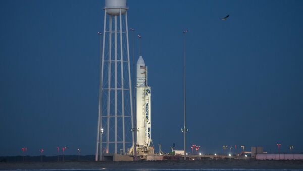 The Orbital ATK Antares rocket, with the Cygnus spacecraft onboard, is seen on launch Pad-0A, at NASA's Wallops Flight Facility in Virginia October 15, 2016. - Sputnik Mundo