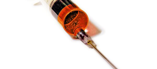 Una jeringa - Sputnik Mundo