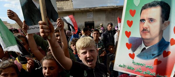Partidarios de Bashar Asad en la ciudad de Hama - Sputnik Mundo