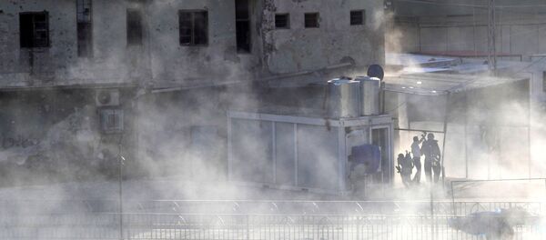 Smoke rises as Kurdish forces take position at a site of an attack by Islamic State militants in Kirkuk - Sputnik Mundo