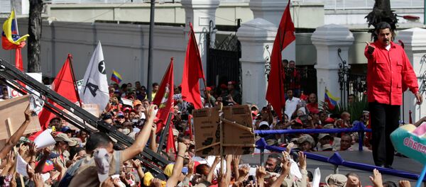 El presidente de Venezuela, Nicolás Maduro, durante las manifestaciones en Caracas - Sputnik Mundo