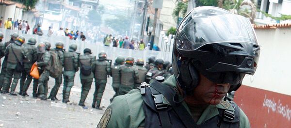 Un efectivo de la Guardia Nacional de Venezuela, herido durante los disturbios - Sputnik Mundo