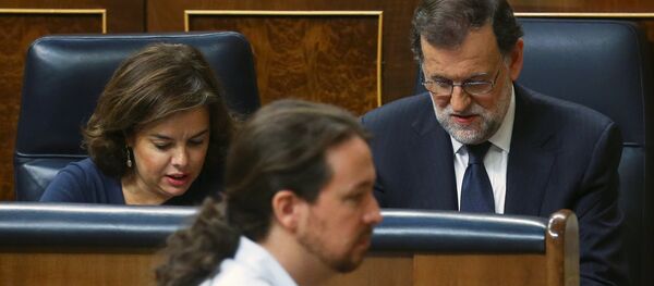 El líder de Podemos, Pablo Iglesias, y el presidente del Gobierno español, Mariano Rajoy - Sputnik Mundo