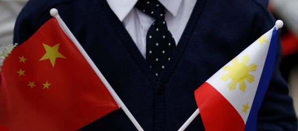 Las banderas de China y las Filipinas Las banderas de China y las Filipinas - Sputnik Mundo