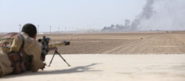 Smoke rises at Islamic State militants' positions southwest of Mosul Smoke rises at Islamic State militants' positions southwest of Mosul - Sputnik Mundo