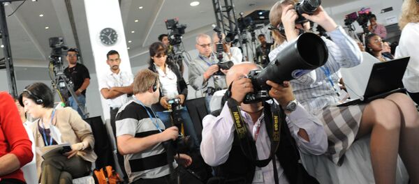 Unos periodistas - Sputnik Mundo