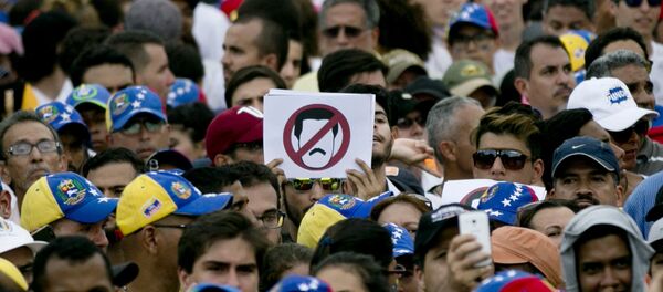 Una protesta de la oposición en Caracas, Venezuela - Sputnik Mundo