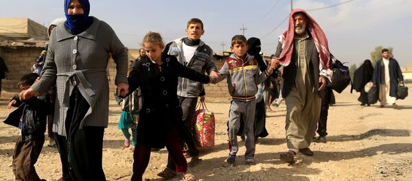 Civiles huyen de Mosul - Sputnik Mundo
