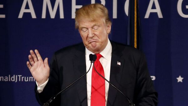 In this Dec. 7, 2015, file photo, Republican presidential candidate, businessman Donald Trump, speaks during a rally coinciding with Pearl Harbor Day at Patriots Point aboard the aircraft carrier USS Yorktown in Mt. Pleasant, S.C. - Sputnik Mundo