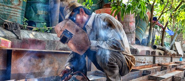 Persona trabajando Persona trabajando - Sputnik Mundo