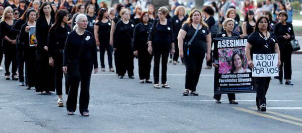 People take part in a demonstration organized by Mujeres de Negro (women in black) against gender violence in Montevideo, Uruguay - Sputnik Mundo