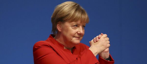 German Chancellor and leader of the conservative Christian Democratic Union party CDU Angela Merkel reacts after her speech at the CDU party convention in Essen, Germany - Sputnik Mundo