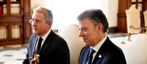 Expresidente de Colombia, Álvaro Uribe, y presidente actual de Colombia, Juan Manuel Santos - Sputnik Mundo
