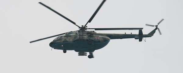 Un helicóptero Mi-8 en la zona del siniestro del Tu-154 en Sochi - Sputnik Mundo