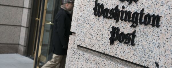 A man walks into the Washington Post's new building March 3, 2016 in Washington, DC A man walks into the Washington Post's new building March 3, 2016 in Washington, DC - Sputnik Mundo
