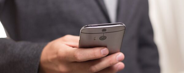 Teléfono móvil - Sputnik Mundo