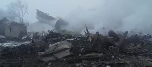 El lugar del siniestro del avión de carga en Kirguistán en imágenes - Sputnik Mundo