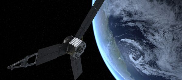 An artist’s rendition shows NASA’s Juno spacecraft as it picks up a gravity-assisted speed boost that will slingshot it into space, toward Jupiter. - Sputnik Mundo