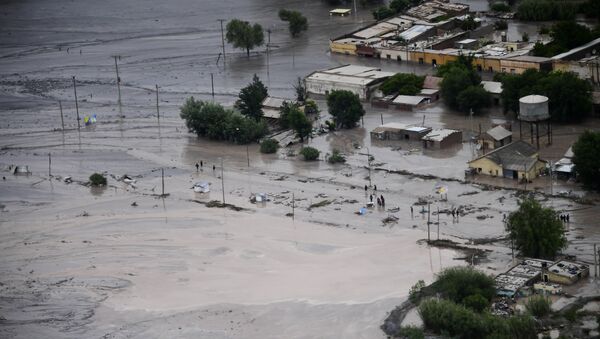 A flooded road is covered in mud after a landslide triggered by a storm in the village of Volcan, Argentina, photographed during stage 8 of the Dakar Rally between Uyuni, Bolivia and Salta, Argentina - Sputnik Mundo