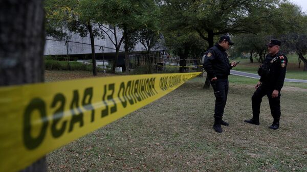 Police officers stand at a police line outside the Colegio Americano del Noreste after a student opened fire at the American school in Monterrey, Mexico - Sputnik Mundo