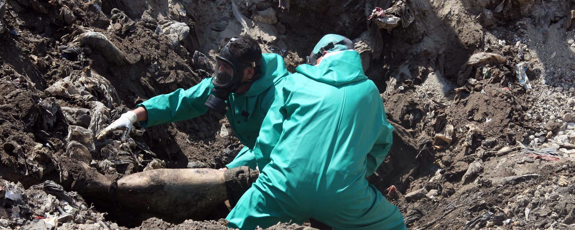 Una fosa común Una fosa común - Sputnik Mundo, 1920, 08.11.2021