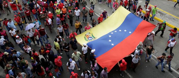 Una marcha progubernamental en Caracas, Venezuela - Sputnik Mundo