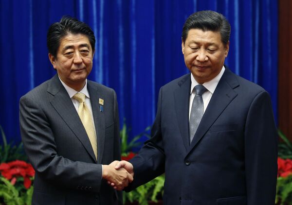 Shinzo Abe y Xi Jinping Shinzo Abe y Xi Jinping - Sputnik Mundo