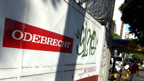 A man walks past the corporate logo of Odebrecht in a construction site in Caracas, Venezuela January 26, 2017 - Sputnik Mundo