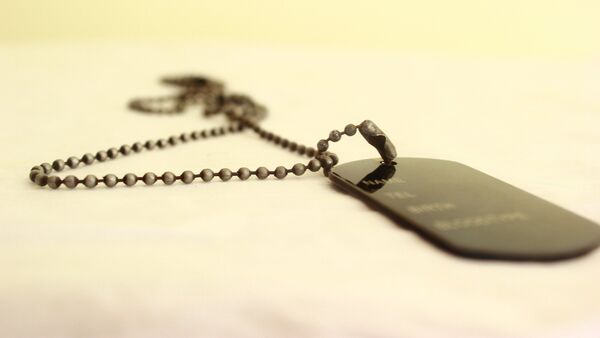 Chapa de identificación - Sputnik Mundo