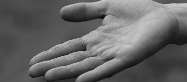 Una mano - Sputnik Mundo