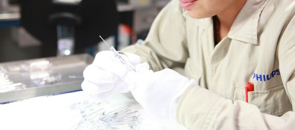 Mujer trabajando - Sputnik Mundo