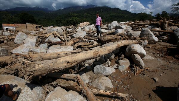 Una avalancha de lodo y piedras en el municipio de Mocoa, Putumayo, Colombia - Sputnik Mundo