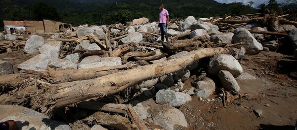 Una avalancha de lodo y piedras en el municipio de Mocoa, Putumayo, Colombia - Sputnik Mundo