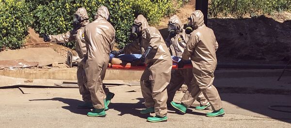 Víctima del ataque químico en Idlib - Sputnik Mundo