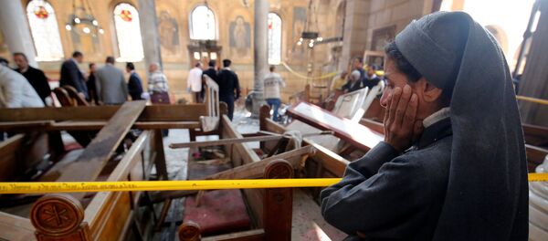 A nun cries as she stands at the scene inside Cairo's Coptic cathedral, following a bombing, in Egypt December 11, 2016 - Sputnik Mundo