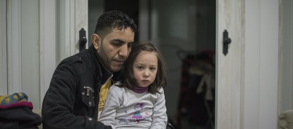 Familia de refugiados sirios - Sputnik Mundo