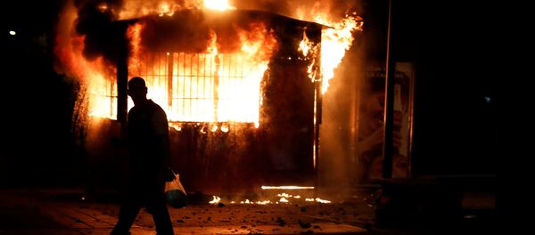 Los disturbios en Caracas Los disturbios en Caracas - Sputnik Mundo