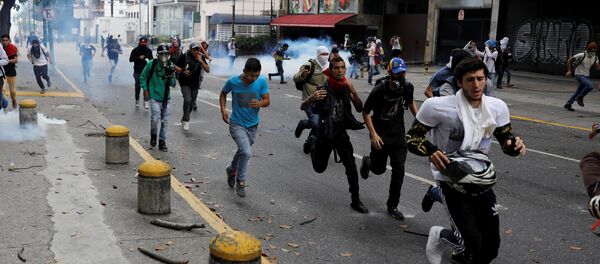 Manifestantes en Caracas, Venezuela - Sputnik Mundo