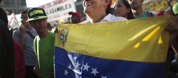 Partidario del partido venezolano PSUV Partidario del partido venezolano PSUV - Sputnik Mundo