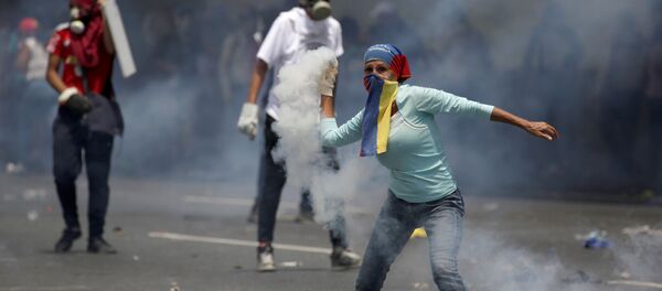 Manifestante en Venezuela Manifestante en Venezuela - Sputnik Mundo
