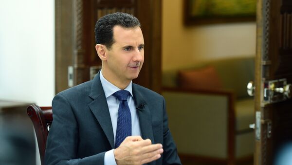 Bashar Asad, presidente sirio, durante la entrevista con la agencia Sputnik - Sputnik Mundo